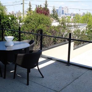Custom Glass Top Railing System With Black Banister | Mountain View Sun Decks